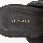 Women's Versace gold buckle black leather sandals