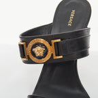 Women's Versace gold buckle black leather sandals