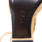 Women's Chanel nude quilted lambskin CC grosgrain cap toe pumps