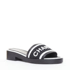 Women's Chanel black white logo embroidered lambskin heeled mules