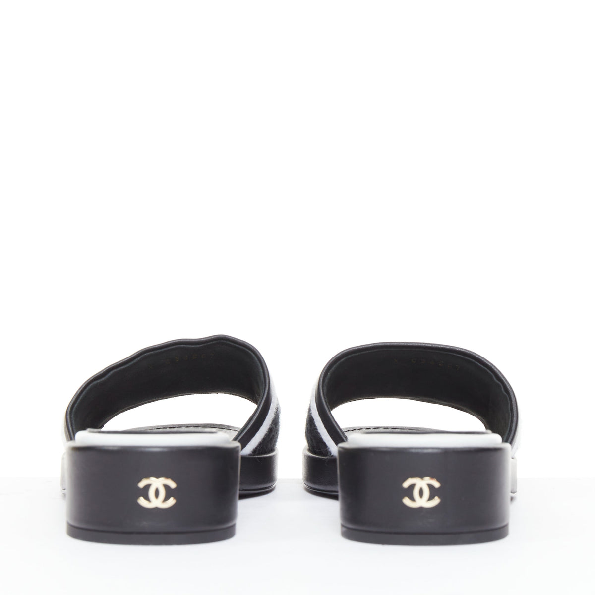 Women's Chanel black white logo embroidered lambskin heeled mules