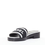 Women's Chanel black white logo embroidered lambskin heeled mules