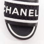 Women's Chanel black white logo embroidered lambskin heeled mules
