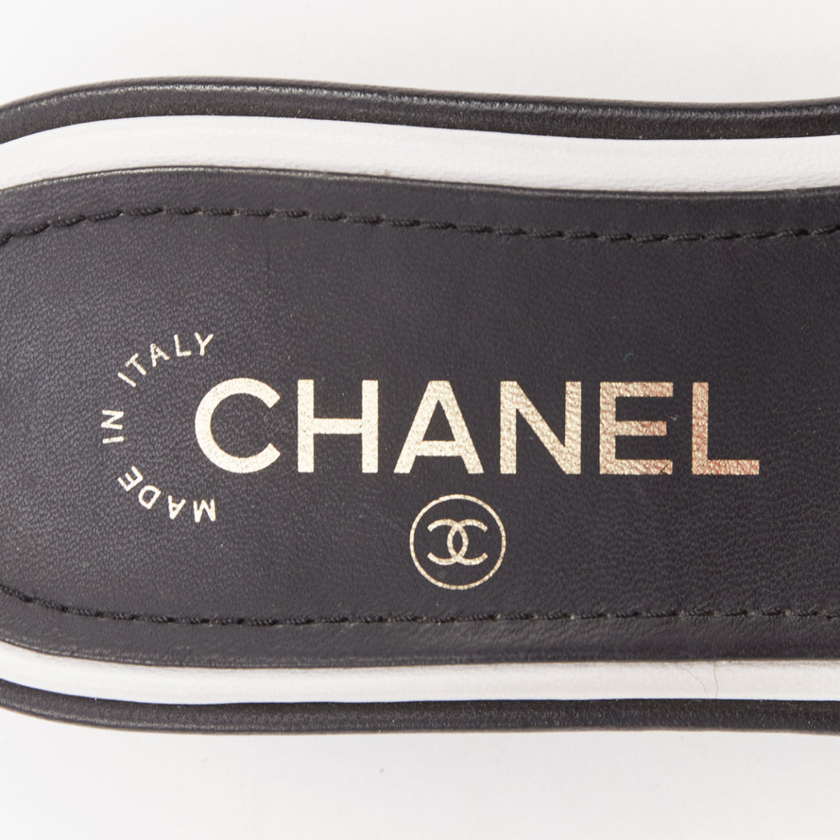Women's Chanel black white logo embroidered lambskin heeled mules