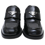 Women's Prada Triangle Logo Loafers in Black Patent Leather