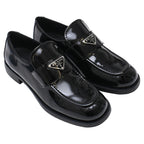 Women's Prada Triangle Logo Loafers in Black Patent Leather