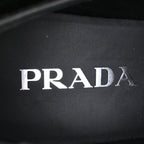 Women's Prada Triangle Logo Loafers in Black Patent Leather